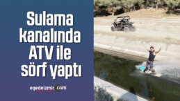 Sulama kanalında ATV ile sörf yaptı