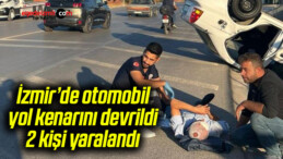 İzmir’de otomobil yol kenarını devrildi, 2 kişi yaralandı