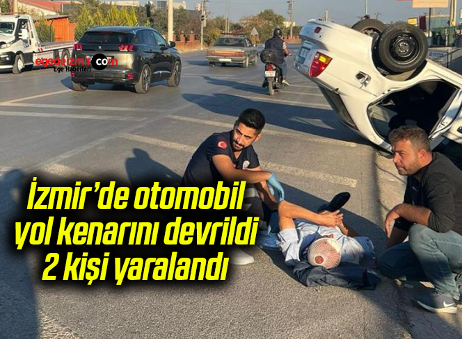 İzmir’de otomobil yol kenarını devrildi, 2 kişi yaralandı